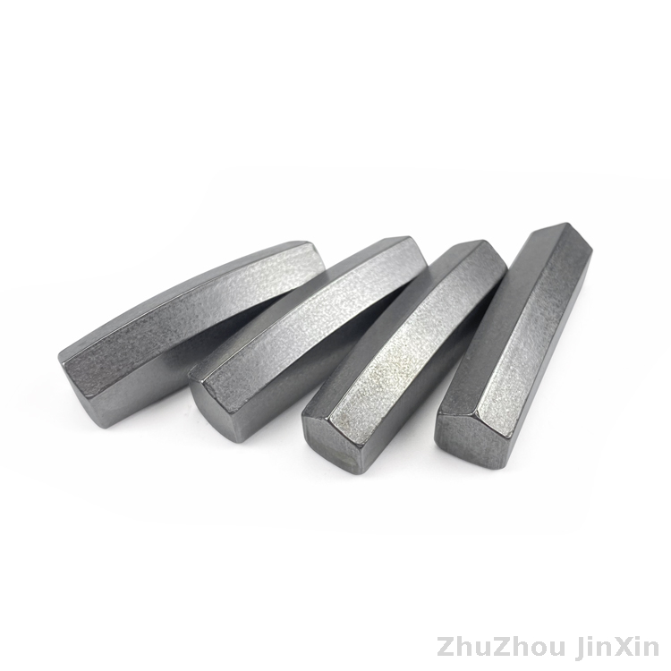 Tungsten carbide alloy brazing blade for rocking drilling tools