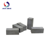 Cemented tungsten carbide brazed tips for adding wear resistance